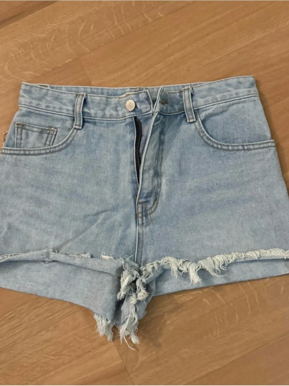 High-Rise Light Blue Denim Jeans with Frayed Hem